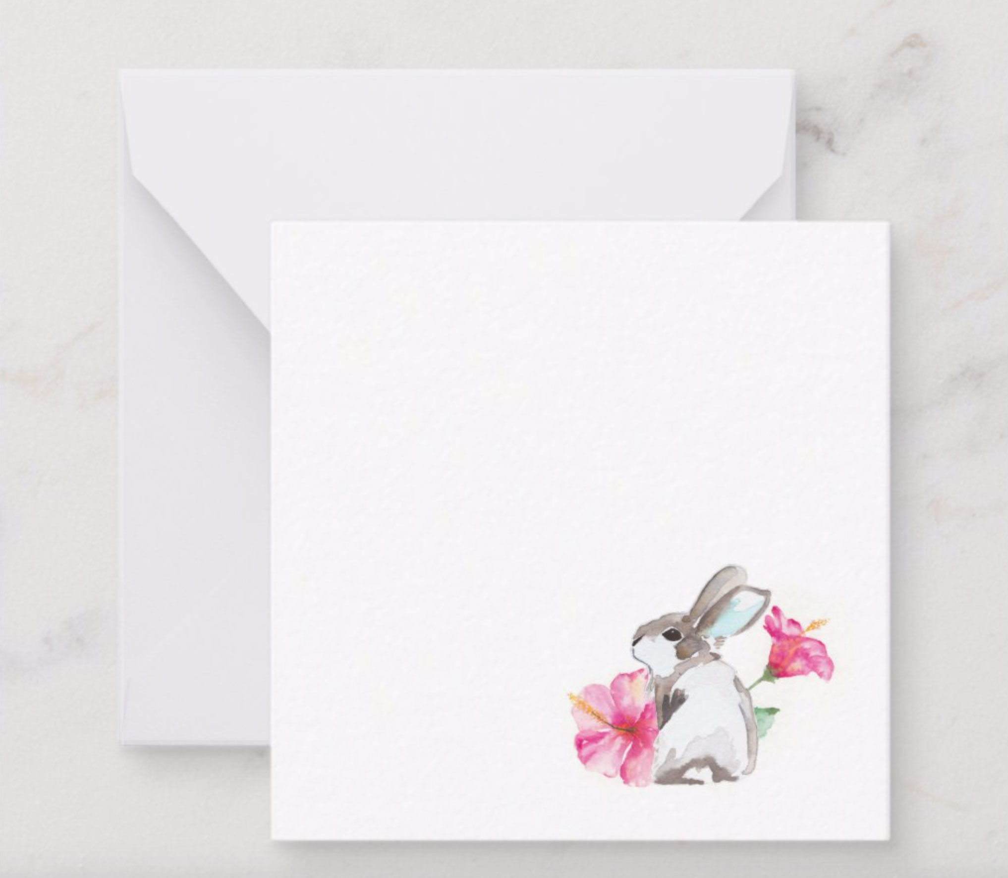 Mini Easter notecard with white envelope features a single bunny rabbit with 2 vibrant pink hibiscus flowers 