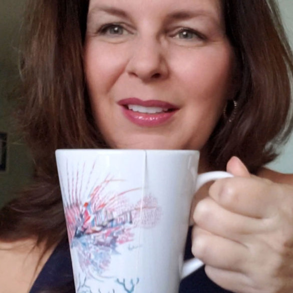 victoria grigaliunas holding lionfish coffee mug