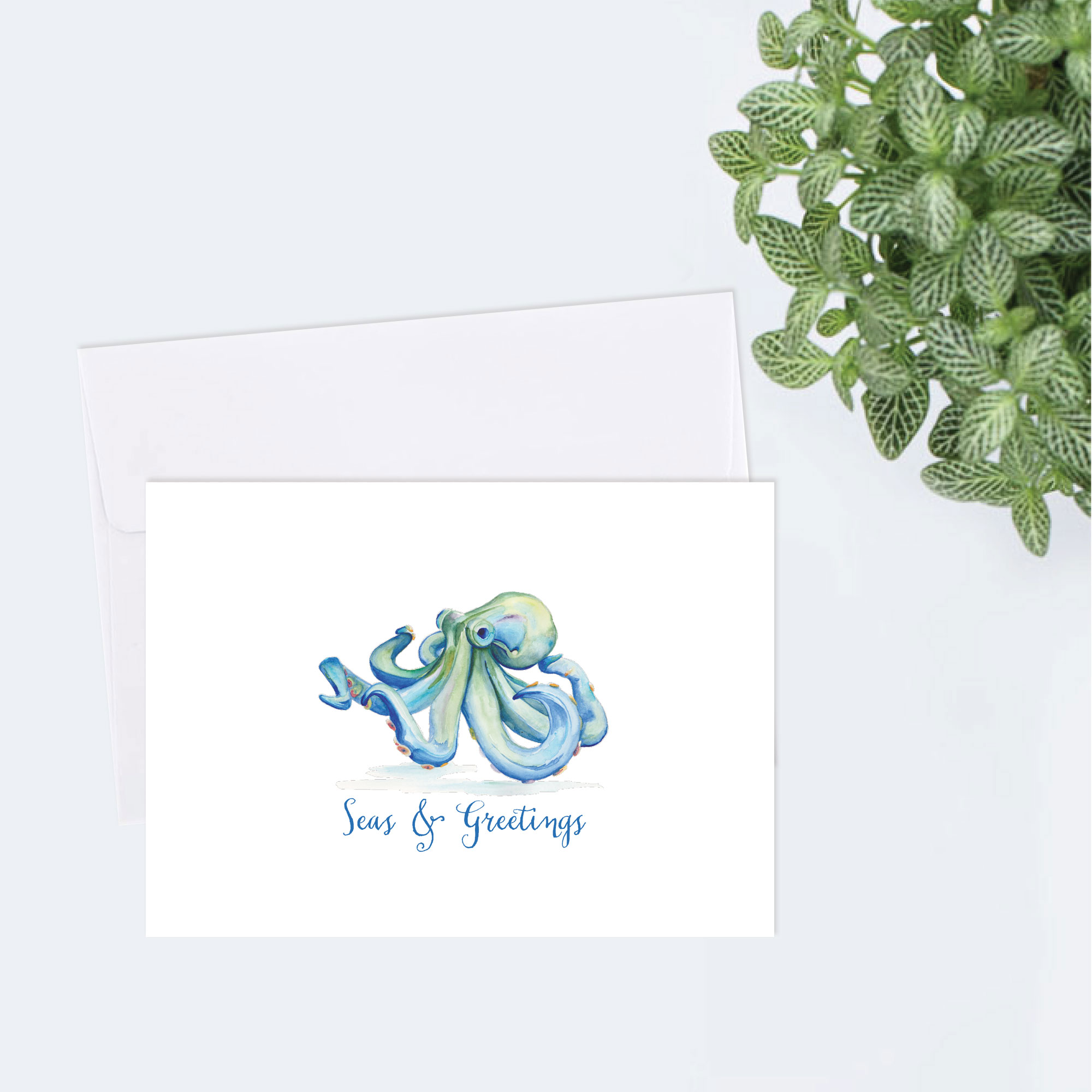 Coastal Christmas Cards 2021 on sale watercolor blue octopus by Victoria Grigaliunas with the words Seas and Greetings