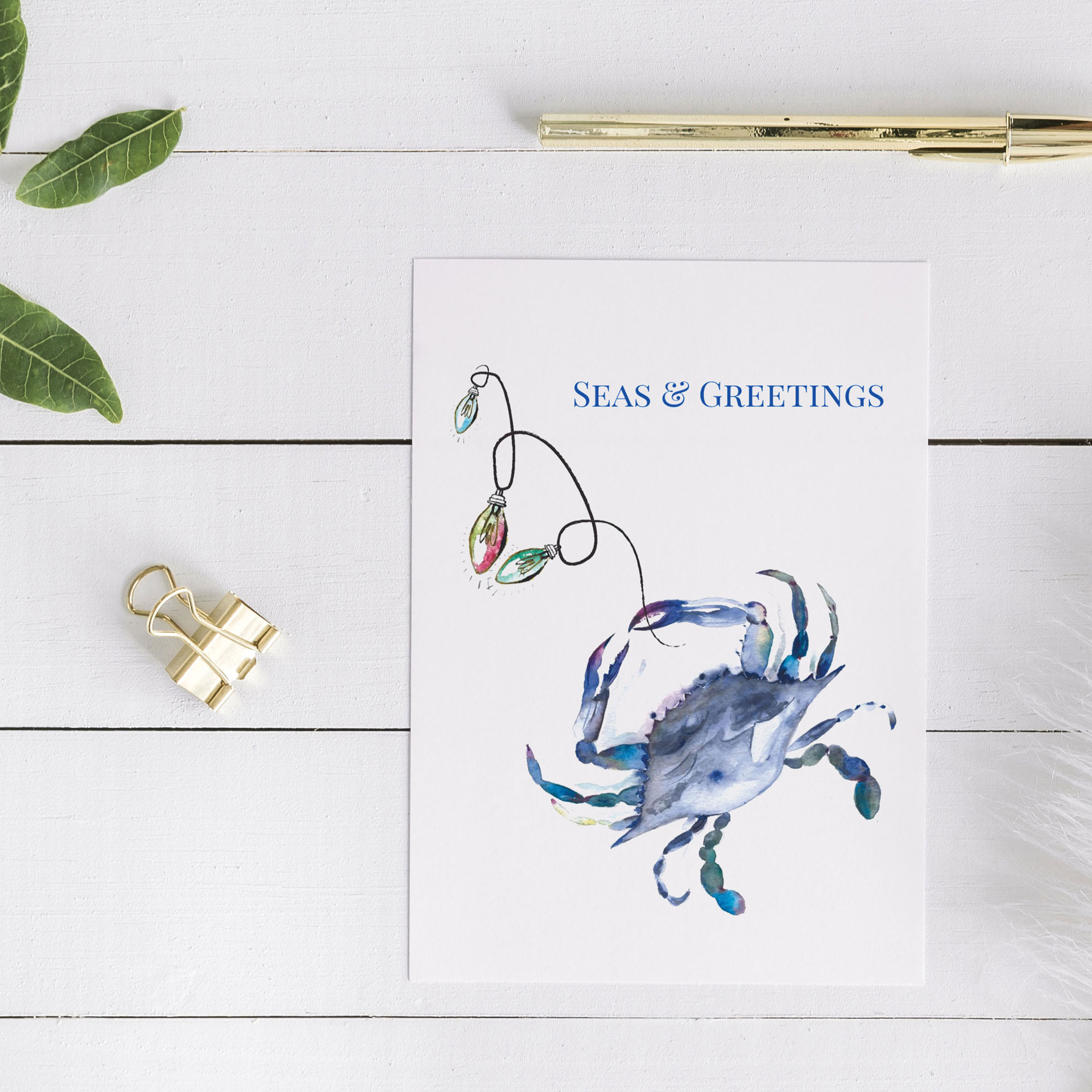 Coastal Christmas Cards 2021 on sale watercolor blue crab by Victoria Grigaliunas with the words Seas and Greetings