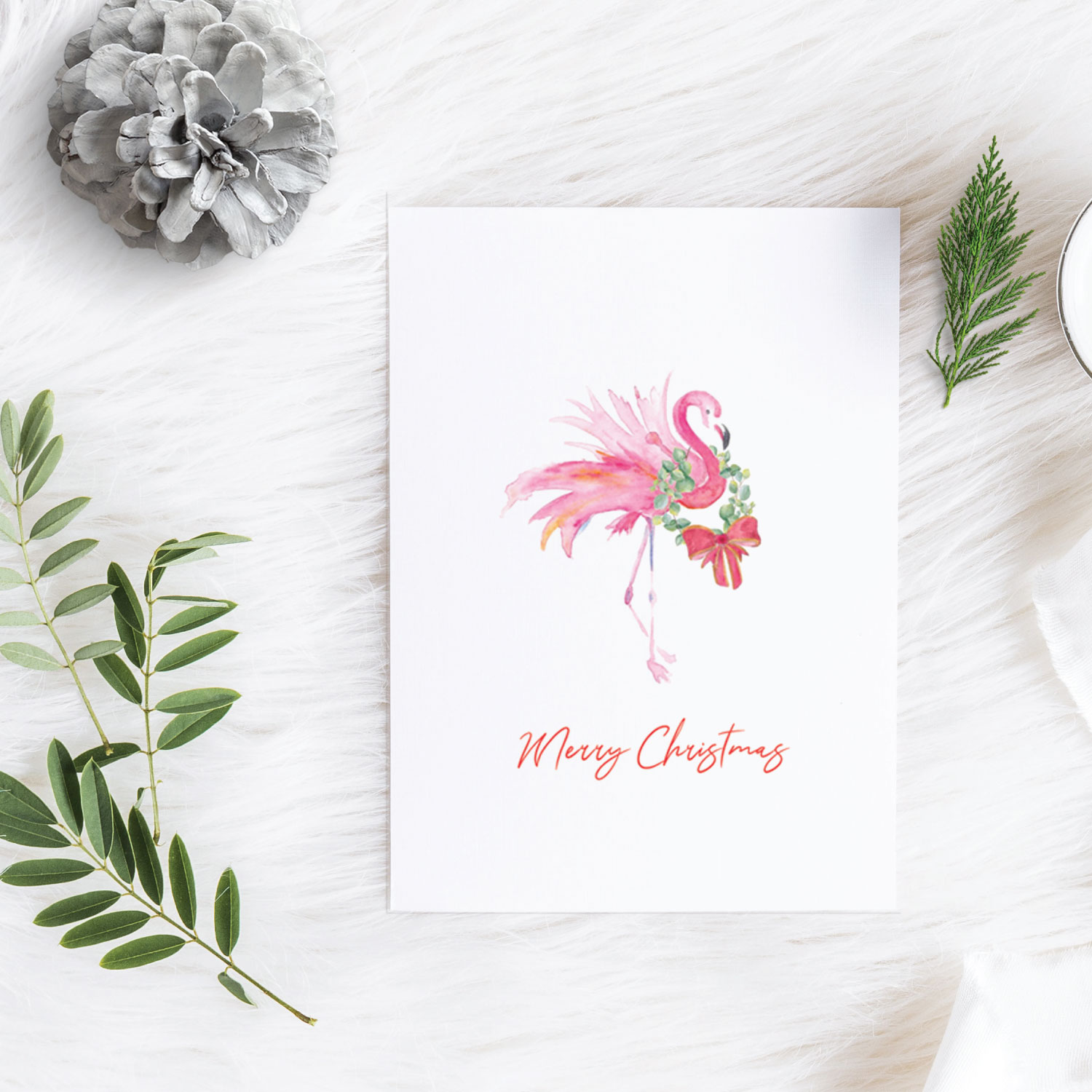 tropical Christmas Cards 2021 on sale watercolor pink flamingo with wreath and red bow by Victoria Grigaliunas with the words Merry Christmas. Click to Shop Christmas Cards 2021