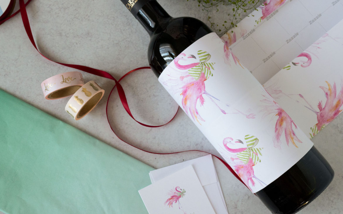 wine gift wrapping ideas using pink flamingo and green bow wrapping paper. Perfect for Palm Beach Christmas.