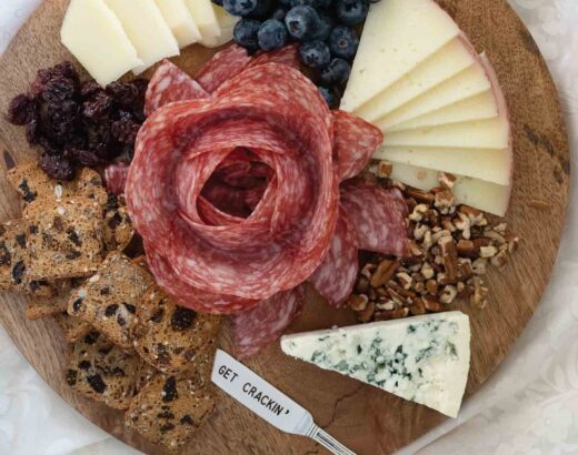 how to make charcuterie image with salami rose and cheese.