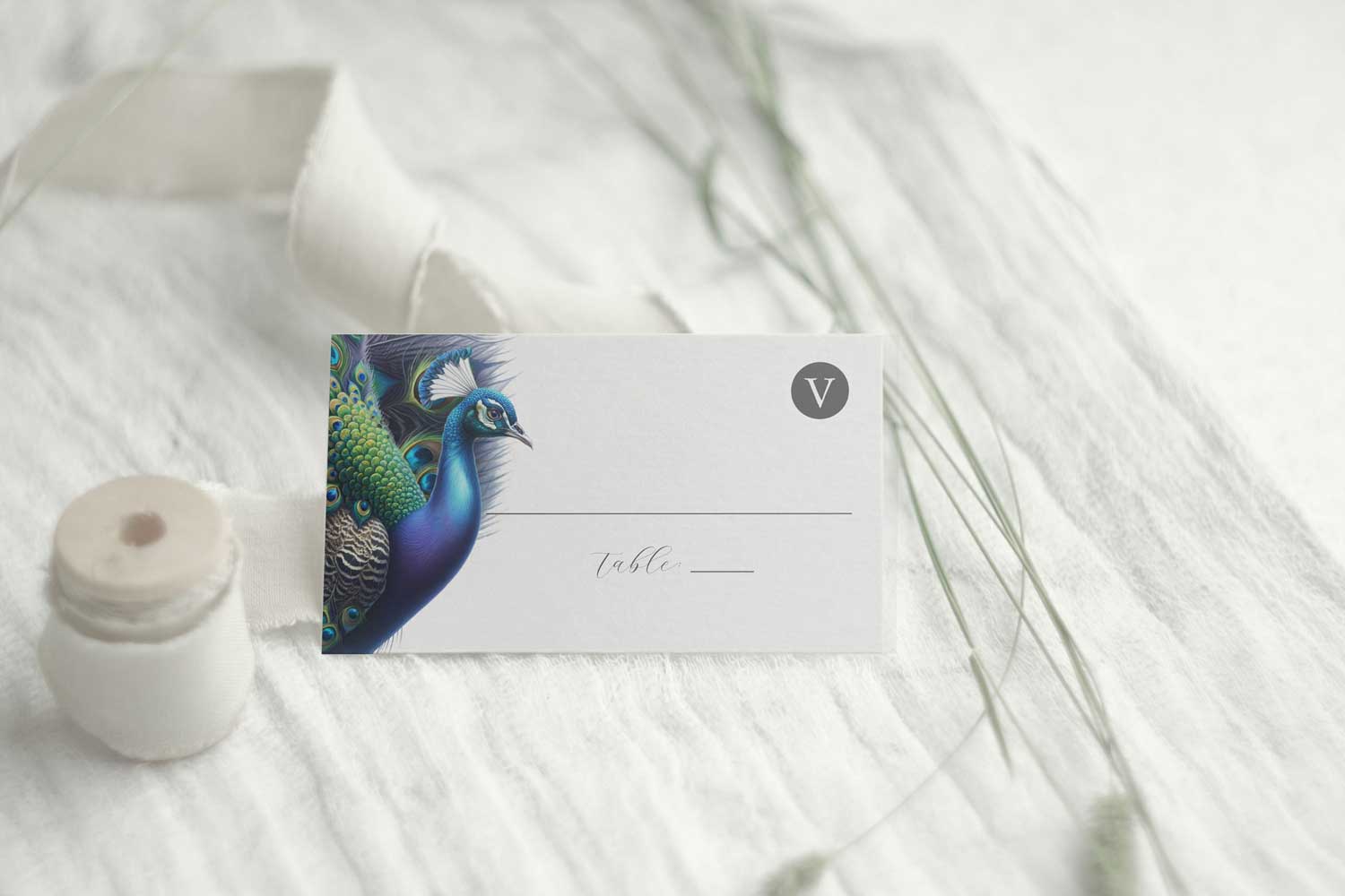 Peacock day of stationery features a place card with meal choice. 