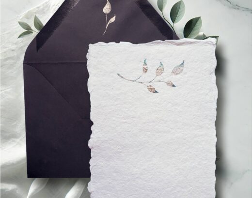 Hand painted artisan watercolor note cards featuring a sprig of botanical leaves in metallic shades.